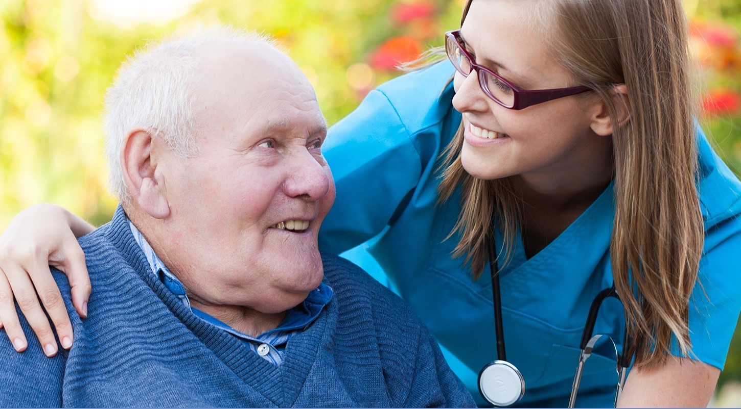 Caregiver Helping an Old Man